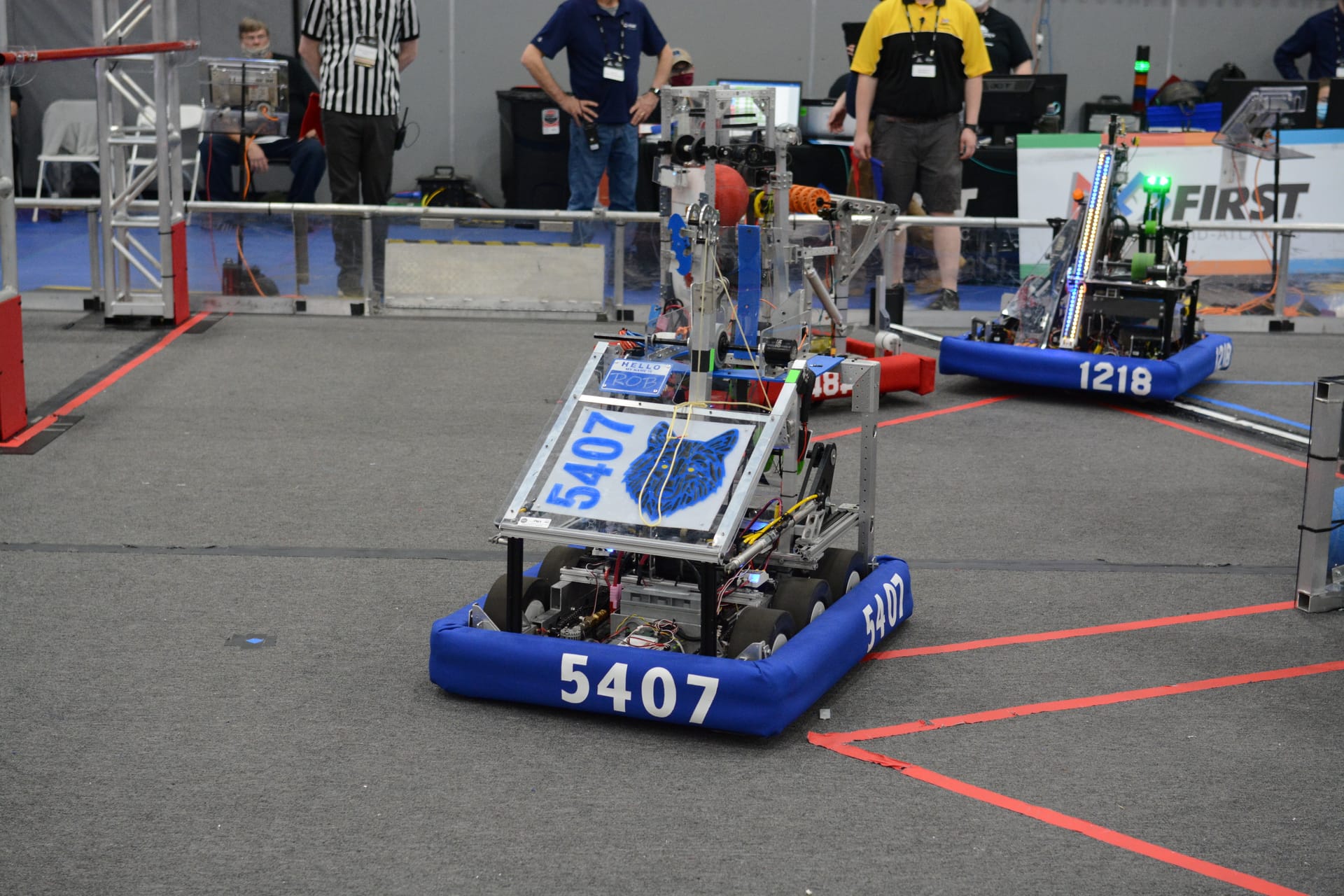 Our 2022 competition robot, showing the large wheels, heavy chassis, and side-mounted climber.
